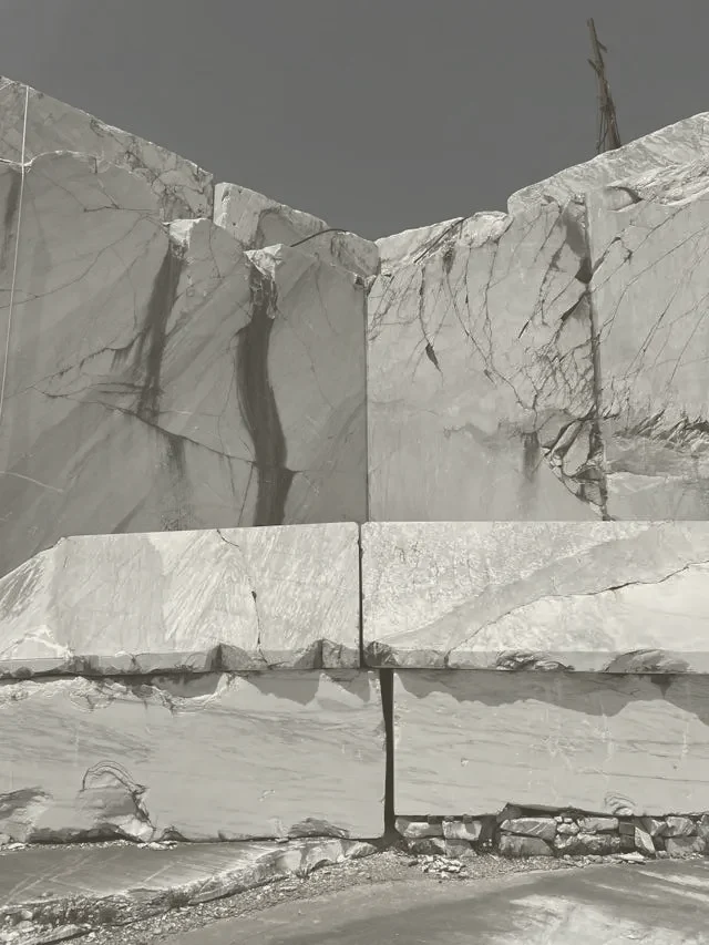 About Us 3 Cut marble blocks stacked at a Stone Harbor quarry yard