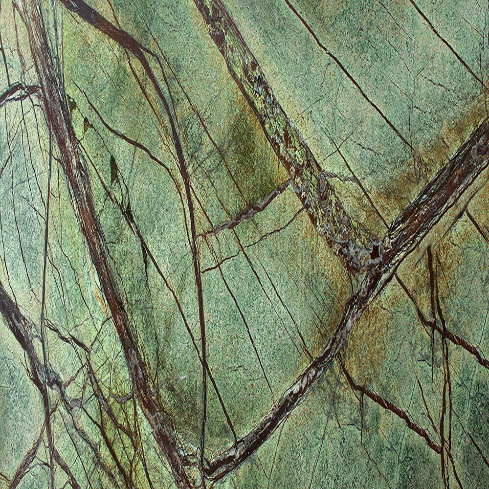 Rainforest Green Marble close-up, deep earthy green with branch-like brown and white veining, Stone Harbor Exports