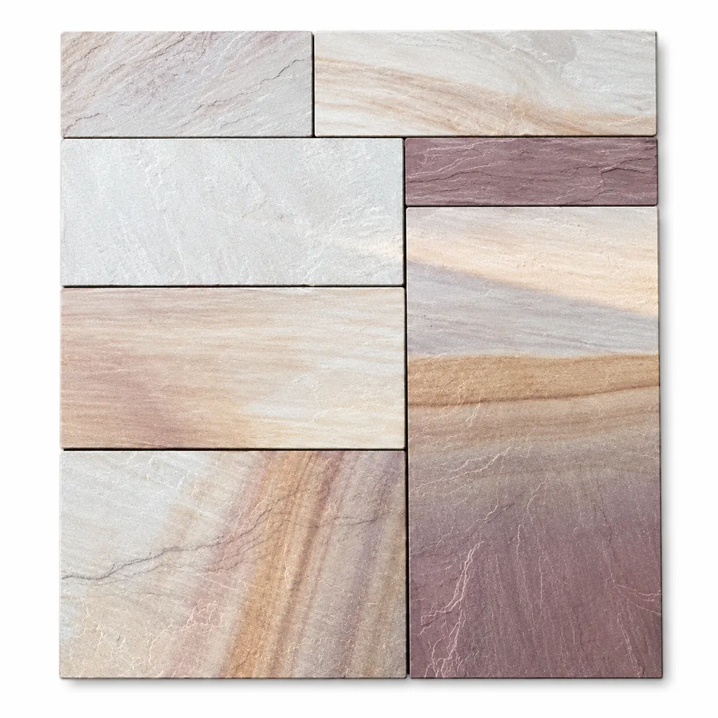 Raveena sandstone paving in mixed sizes with blended pink, grey, beige, rust and plum tones