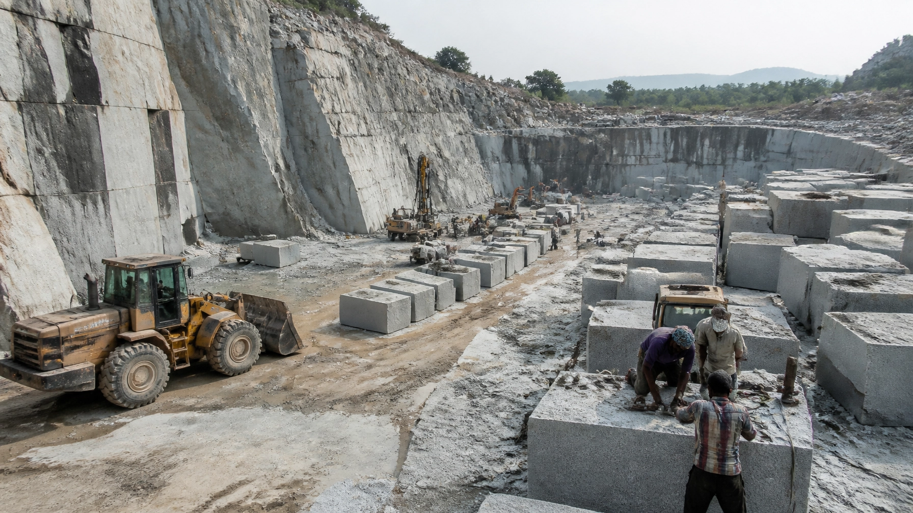 Active granite quarry in India, showing the large-scale extraction of grey granite blocks for global export.