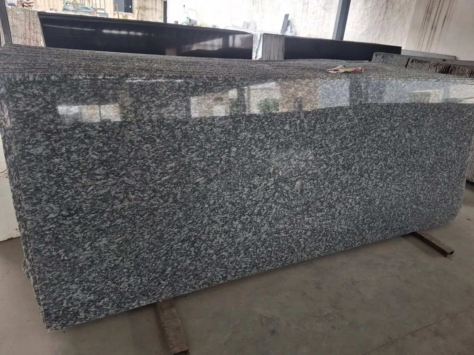 Exporting Excellence: How Stone Harbor Ensures Quality in Every Slab 2 Polished granite slabs with consistent patterns ready for export and global shipping