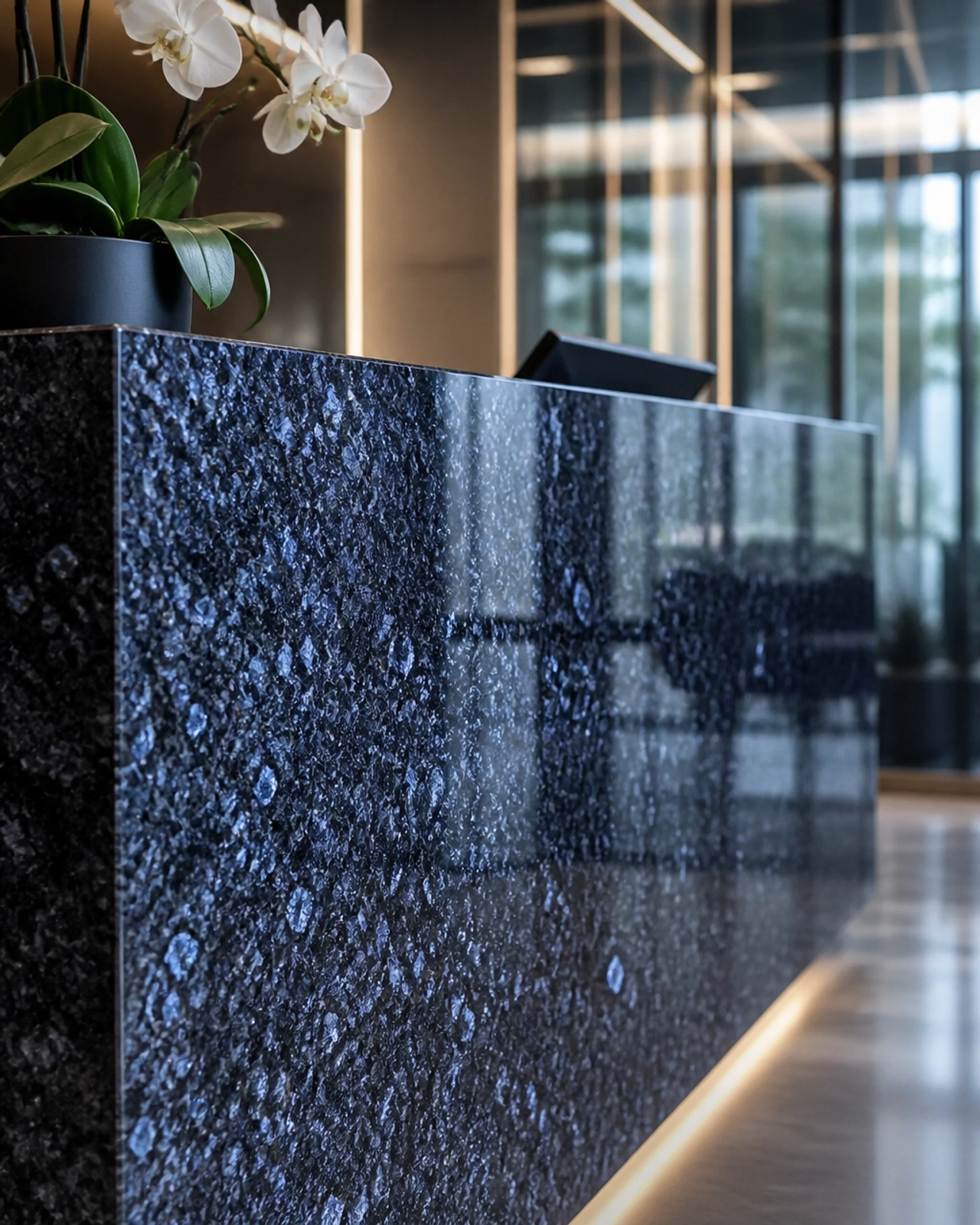 Visual Depth: Why Blue Pearl Royal Granite Remains a Global Favorite for Statement Lobbies 2 A monolithic reception desk crafted from Blue Pearl Royal Granite