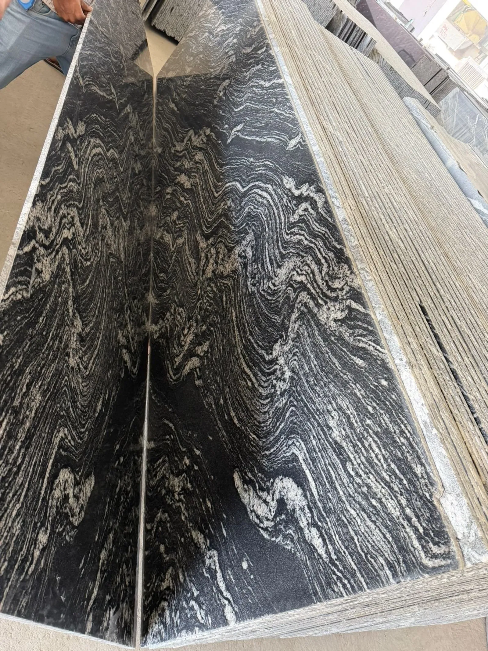 Dark Elegance: Navigating the Grading Systems of Black Granite Stone for International Buyers 3 Bookmatched black and white granite slabs, showing high-precision finishing for luxury projects