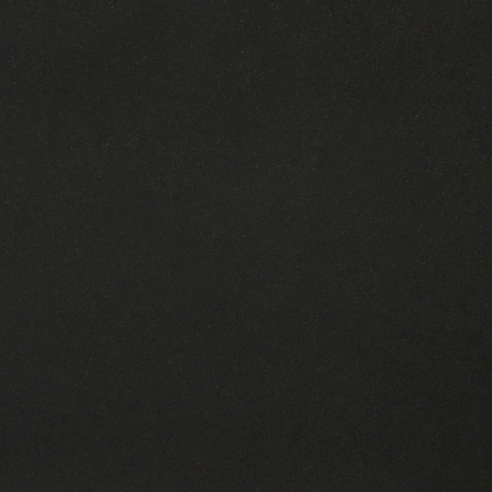 Dark Elegance: Navigating the Grading Systems of Black Granite Stone for International Buyers 1 High-quality Absolute Black Granite slab showing a deep, fine-grained surface
