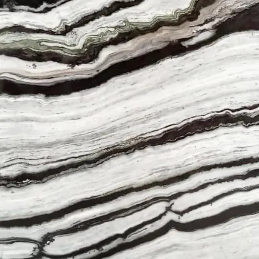 Panda White Marble close-up, bright white with bold flowing black bands, Stone Harbor Exports
