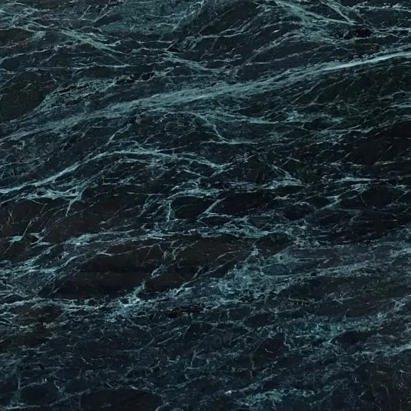 Spider Green Marble close-up, deep green-black with a web of white and pale-green veins, Stone Harbor Exports